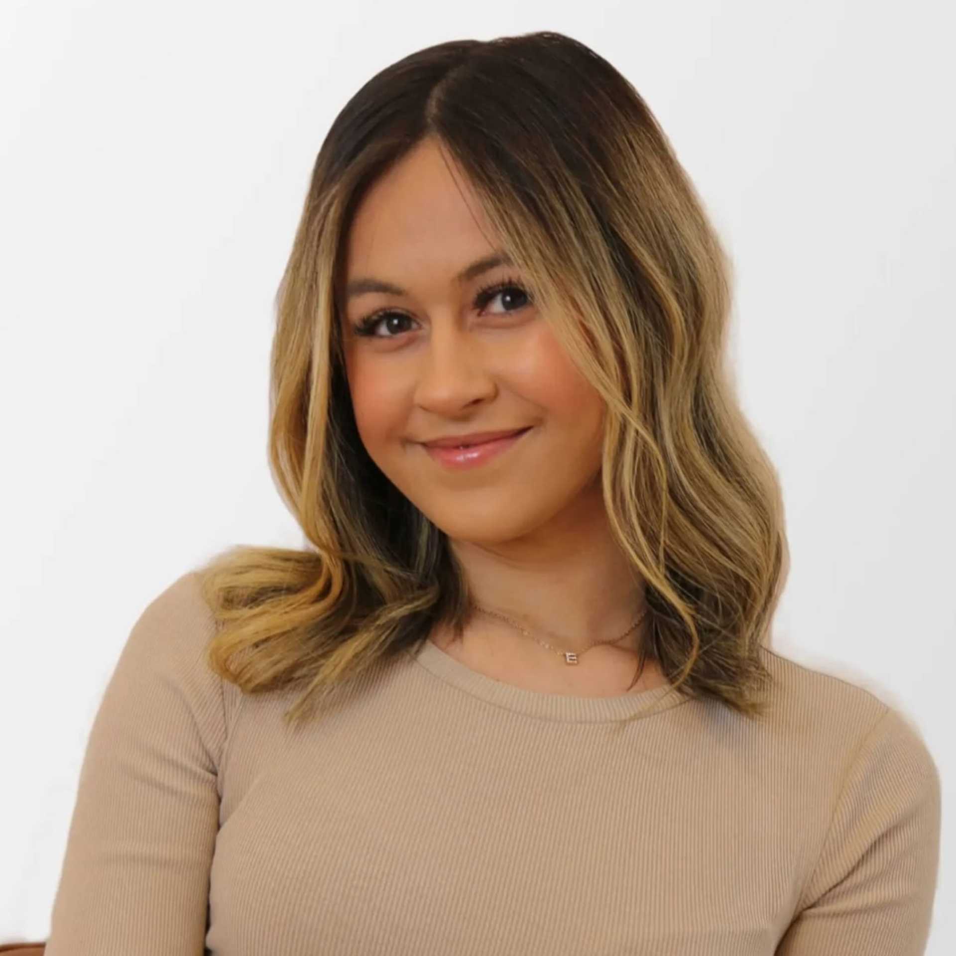 Portrait of Evelyna Straoverova, a professional stylist at Chromatique Salon, showcasing their expertise and style.