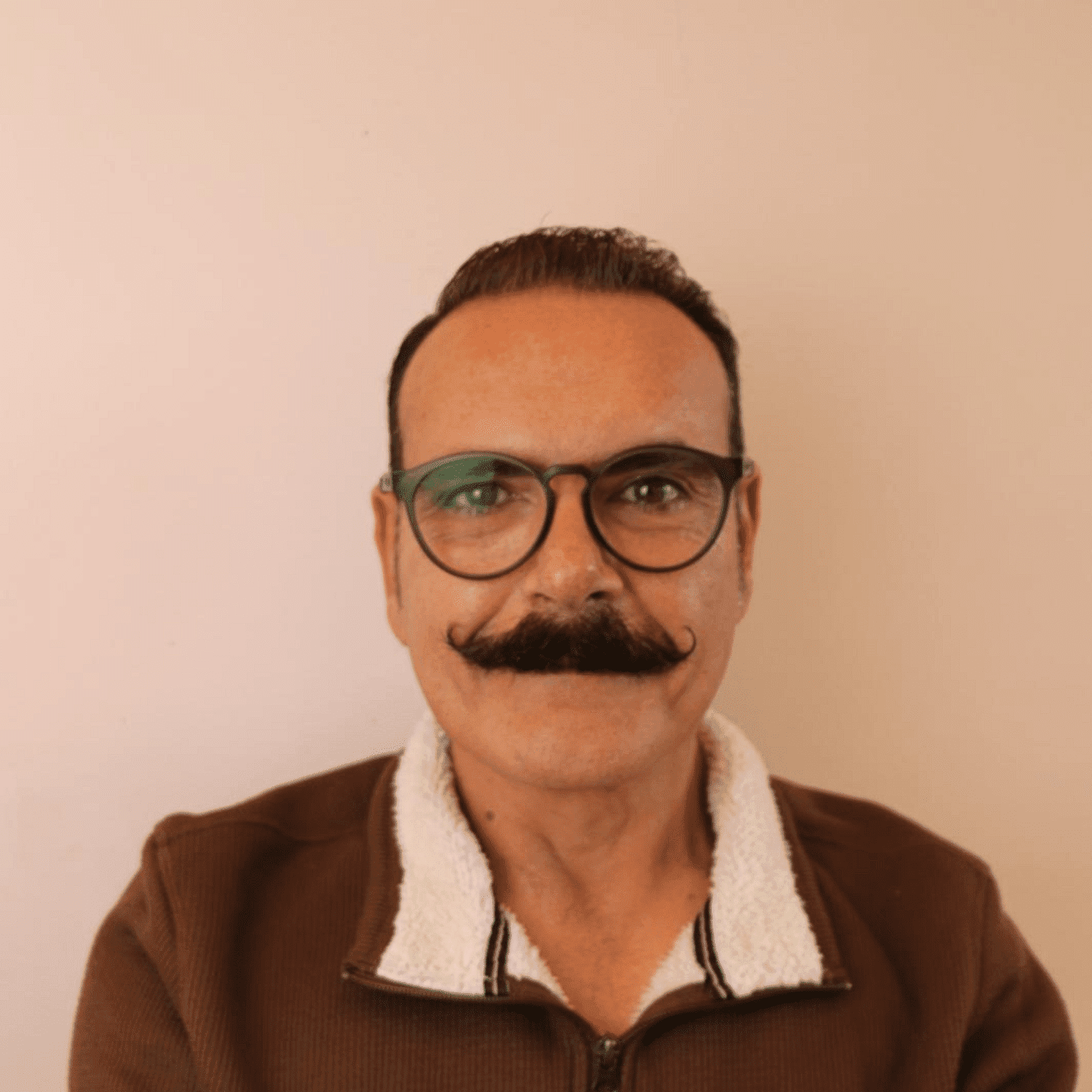 Portrait of Roger Chase, a professional stylist at Chromatique Salon, showcasing their expertise and style.