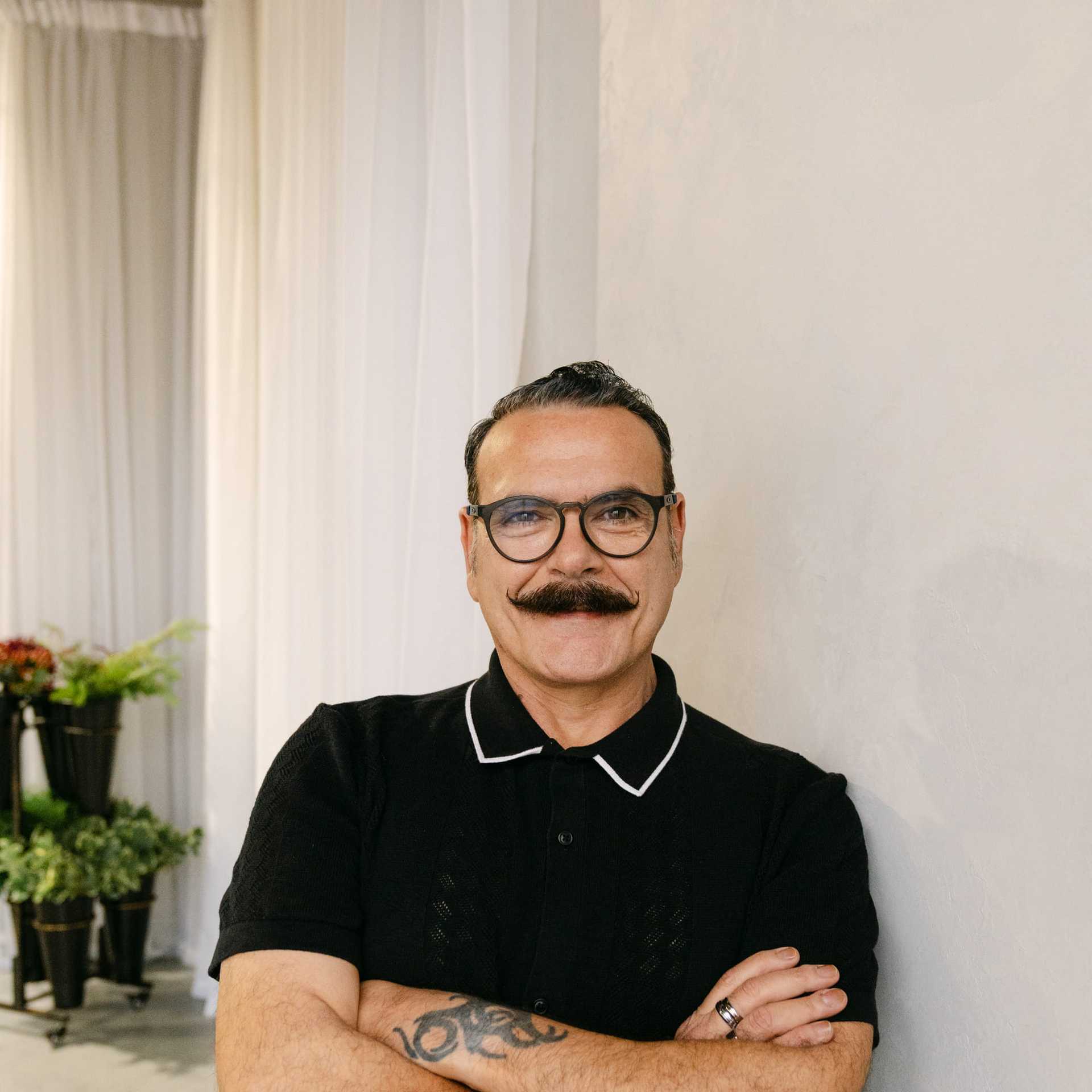 Portrait of Roger Chase, a professional stylist at Chromatique Salon, showcasing their expertise and style.