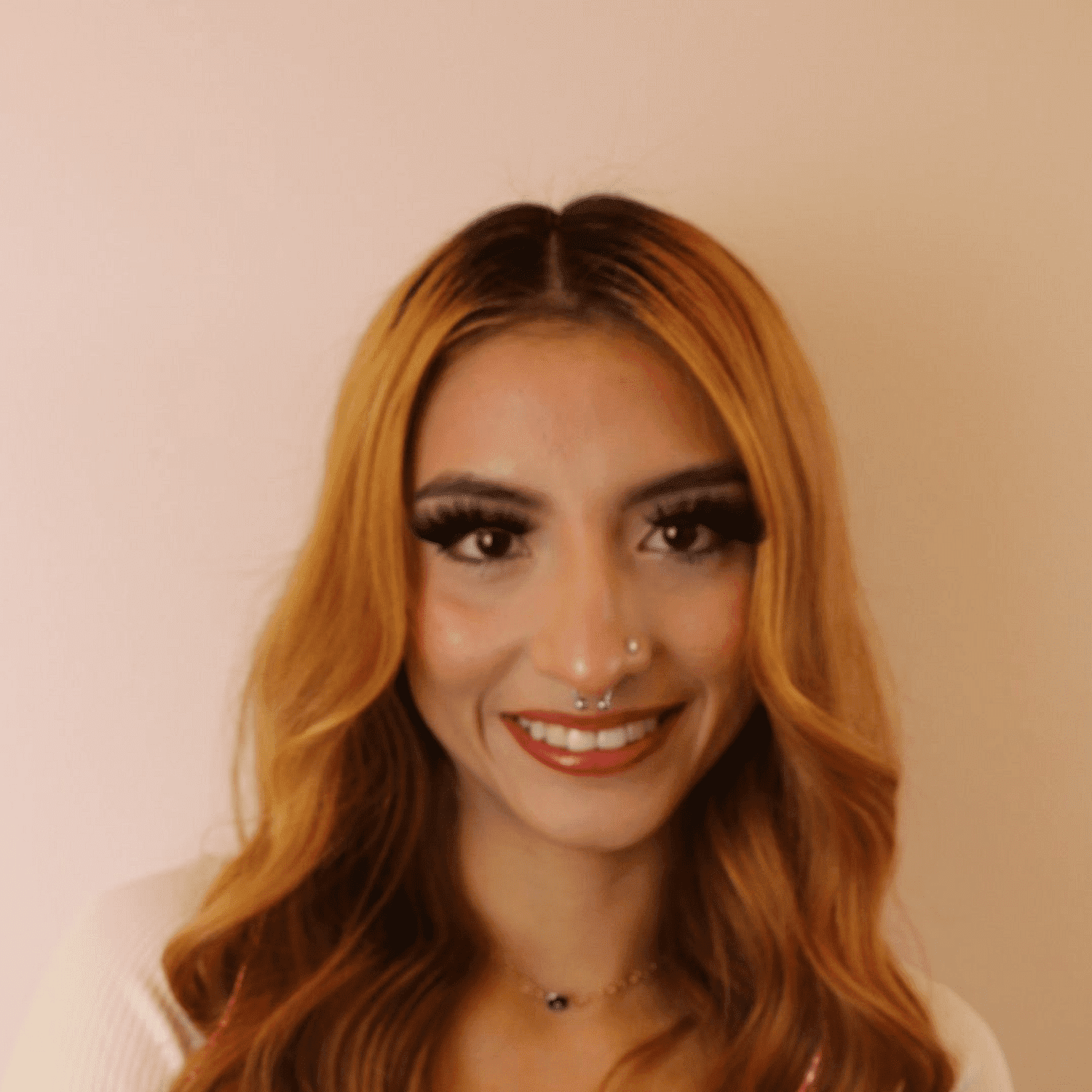Portrait of Adriana, a professional stylist at Chromatique Salon, showcasing their expertise and style.