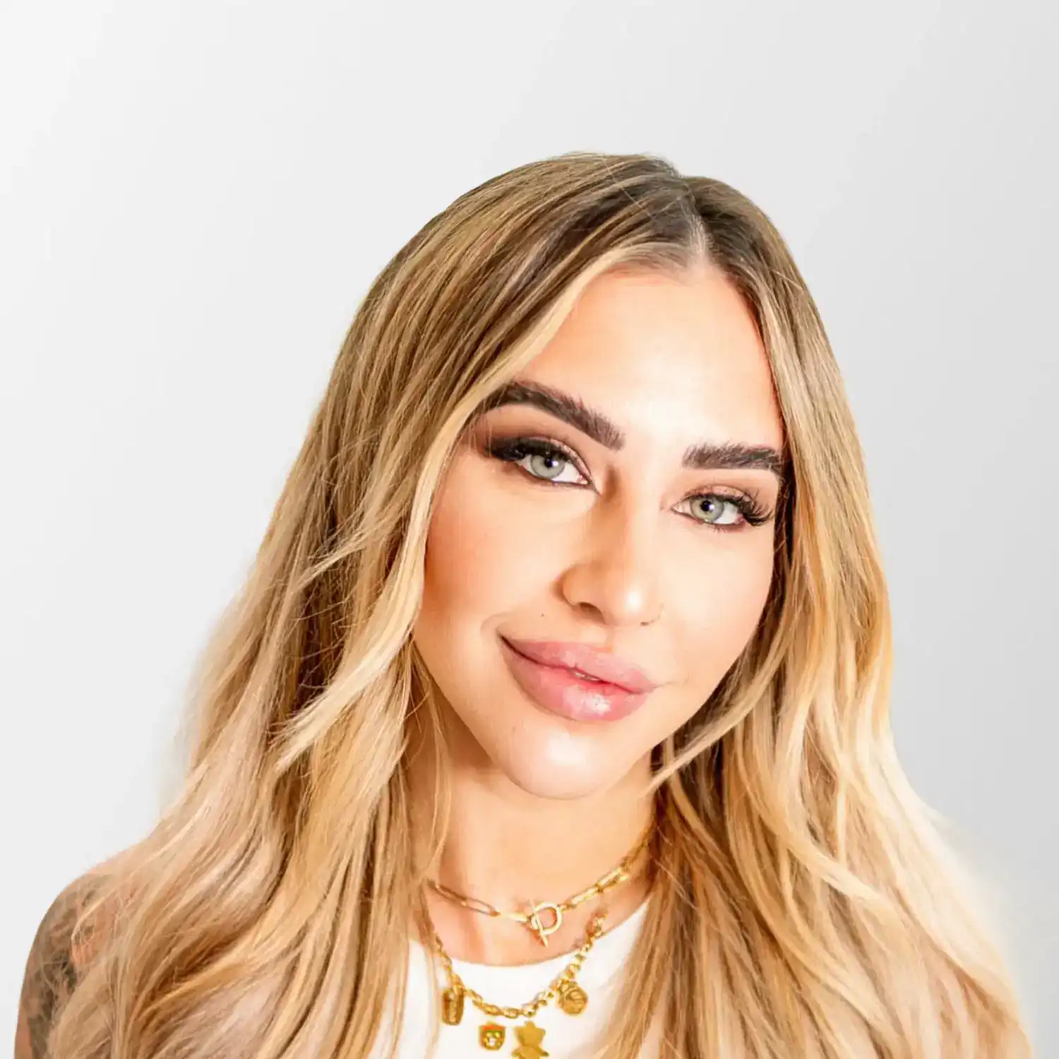 Portrait of Brittany, a professional stylist at Chromatique Salon, showcasing their expertise and style.
