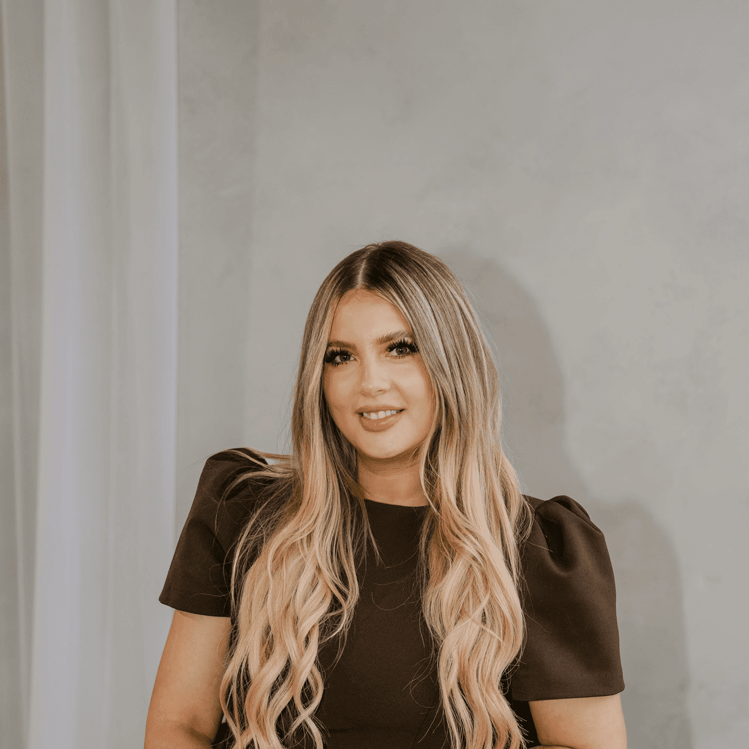 Portrait of Elle Levine, a professional stylist at Chromatique Salon, showcasing their expertise and style.
