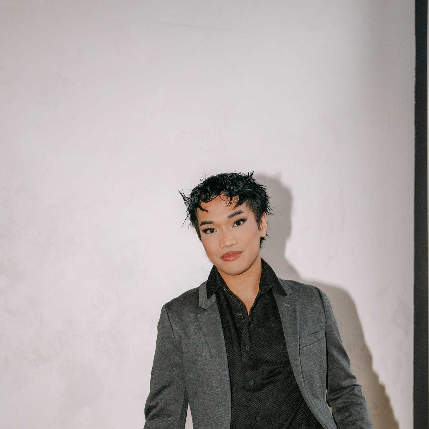 Portrait of Jai Jiminez, a professional stylist at Chromatique Salon, showcasing their expertise and style.