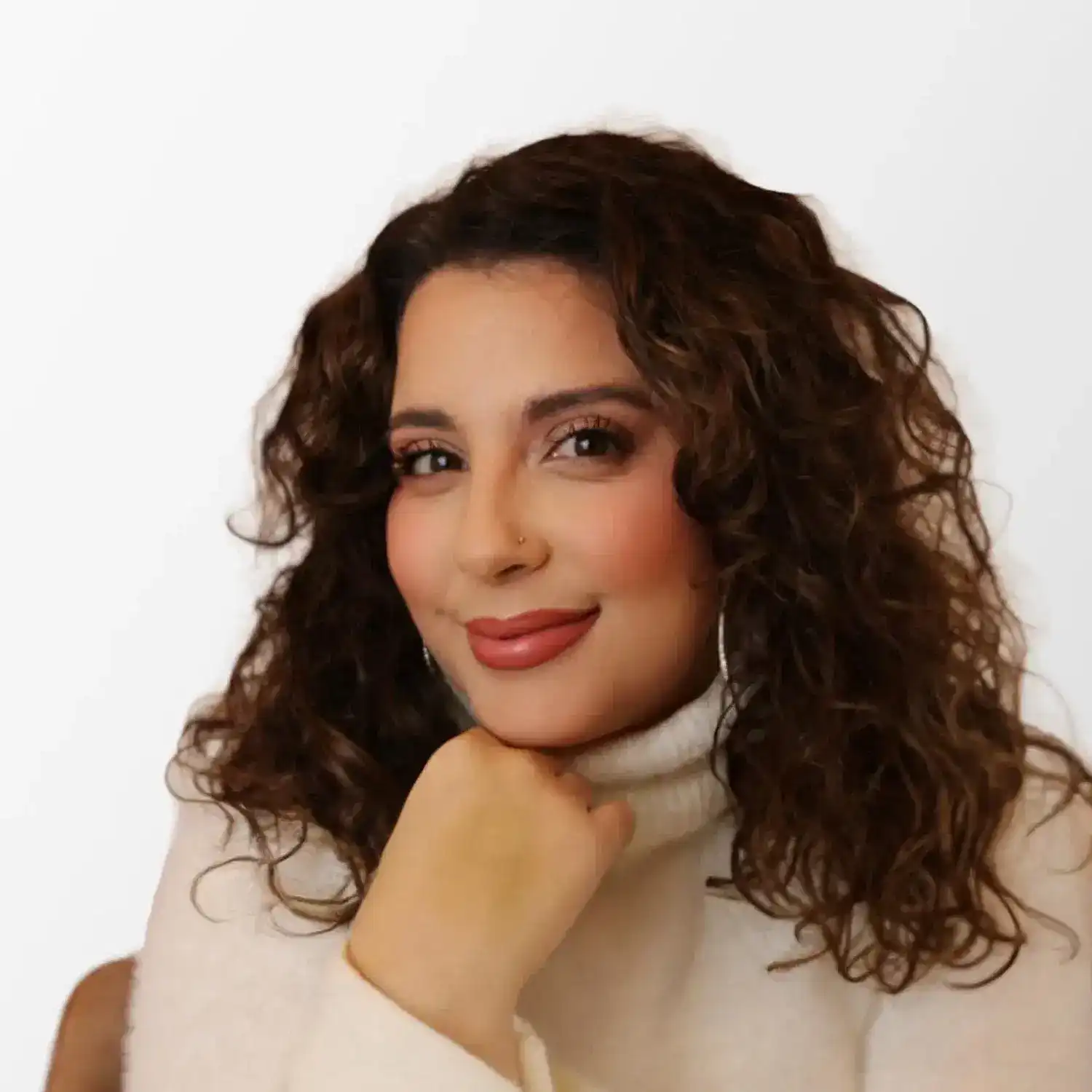 Portrait of Erika Gilbert, a professional stylist at Chromatique Salon, showcasing their expertise and style.