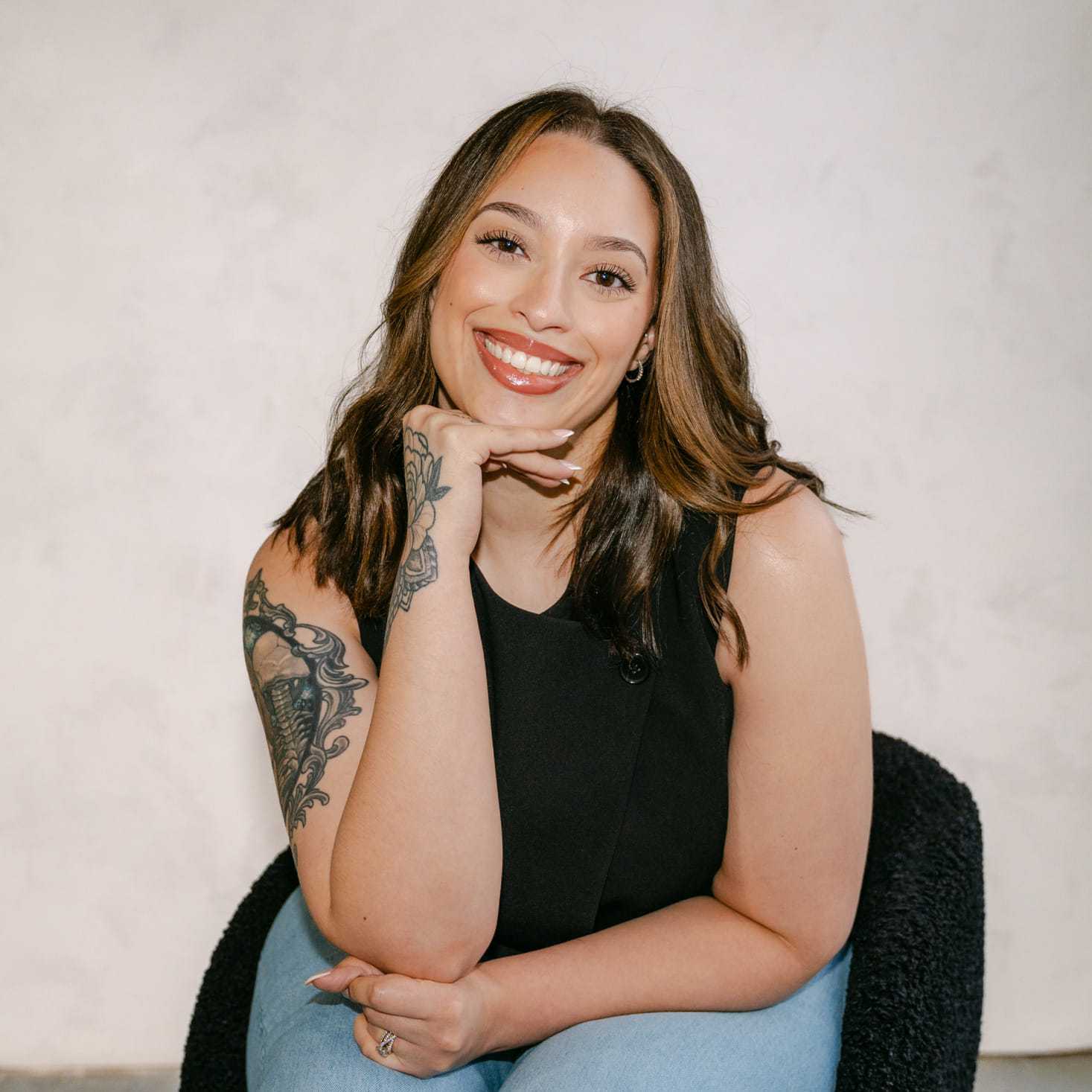 Portrait of Cierra Jarrell, a professional stylist at Chromatique Salon, showcasing their expertise and style.