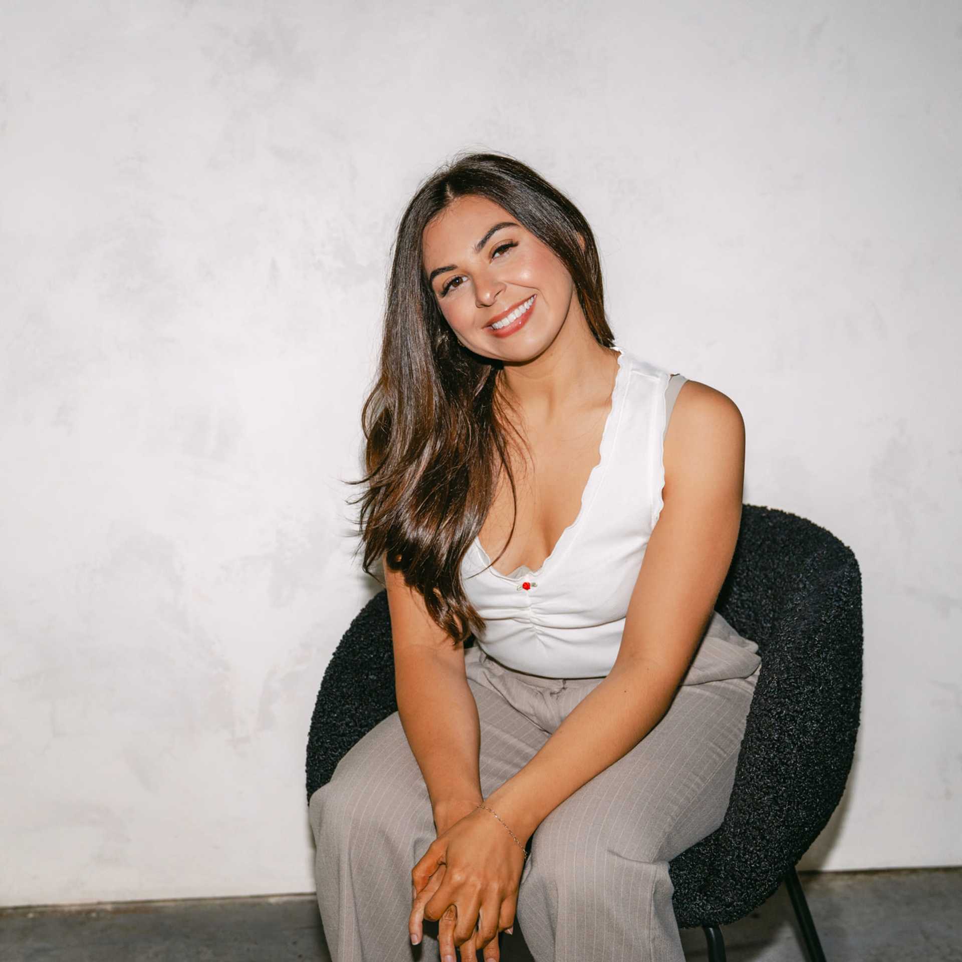 Portrait of Antonia Martinez, a professional stylist at Chromatique Salon, showcasing their expertise and style.