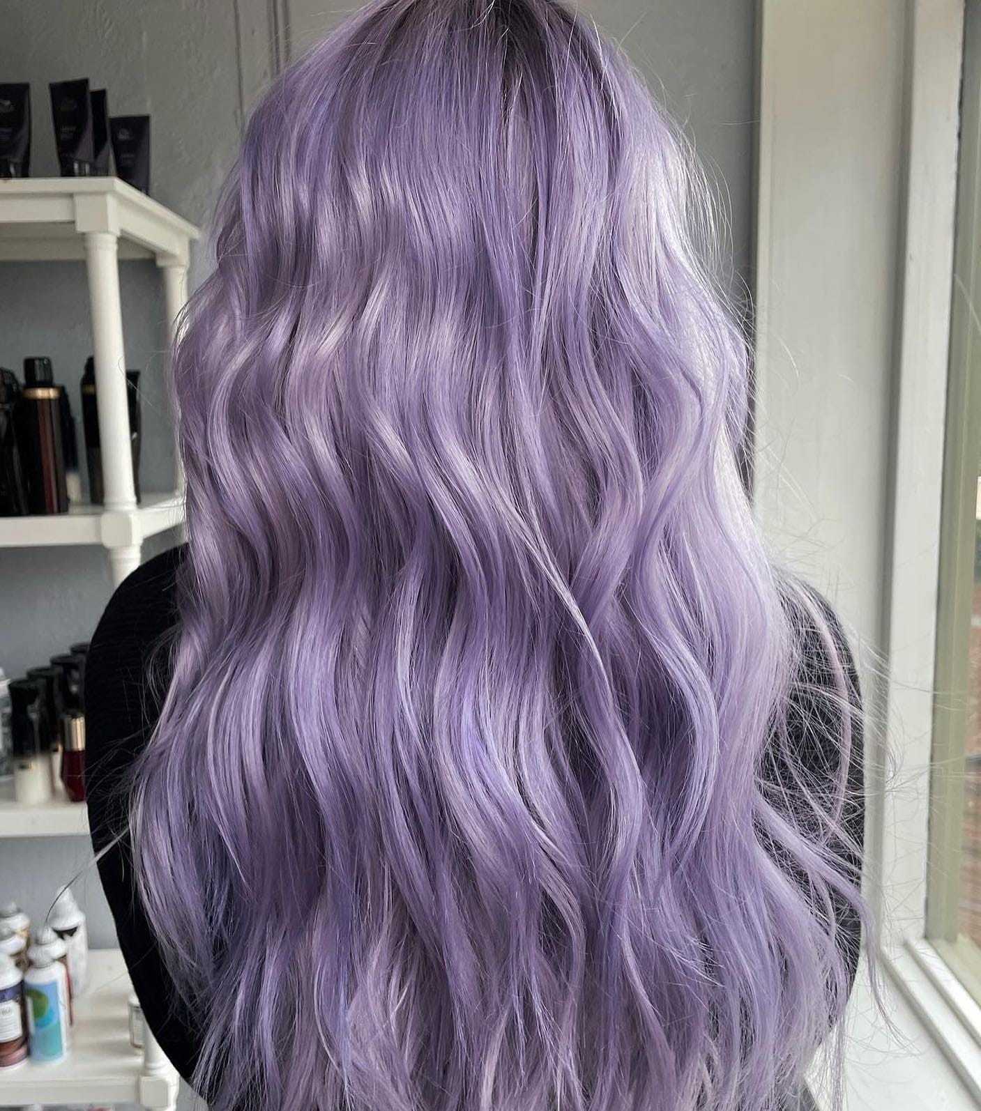 Wavy lavender hair with subtle highlights, styled in loose waves, shown from the back.