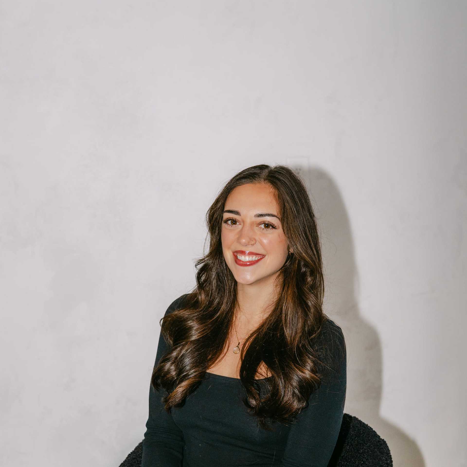 Portrait of Erin Dubots, a professional stylist at Chromatique Salon, showcasing their expertise and style.