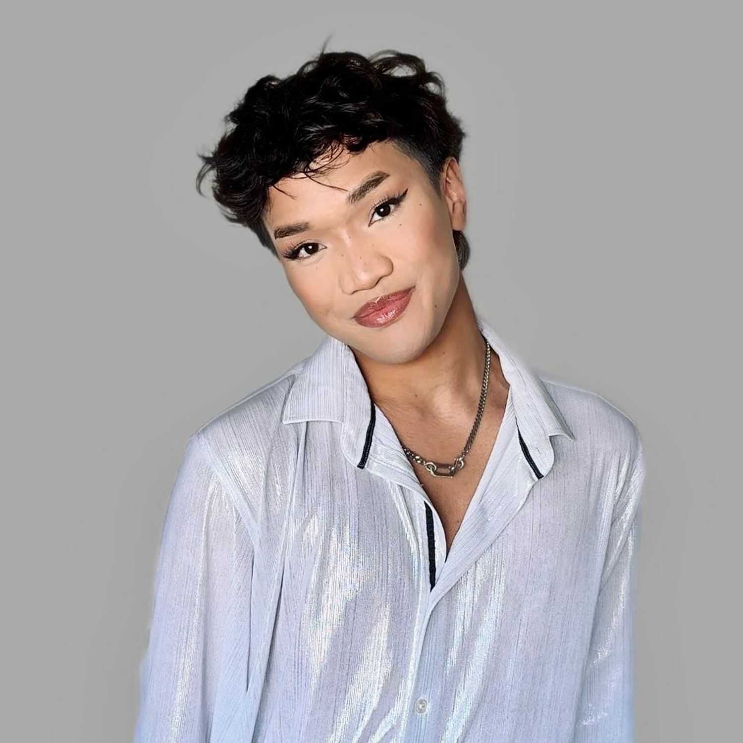 Portrait of Jai Jiminez, a professional stylist at Chromatique Salon, showcasing their expertise and style.
