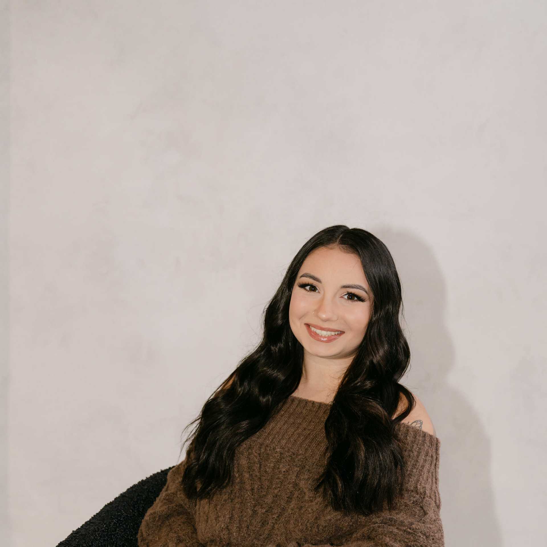 Portrait of Arianna Boprey, a professional stylist at Chromatique Salon, showcasing their expertise and style.