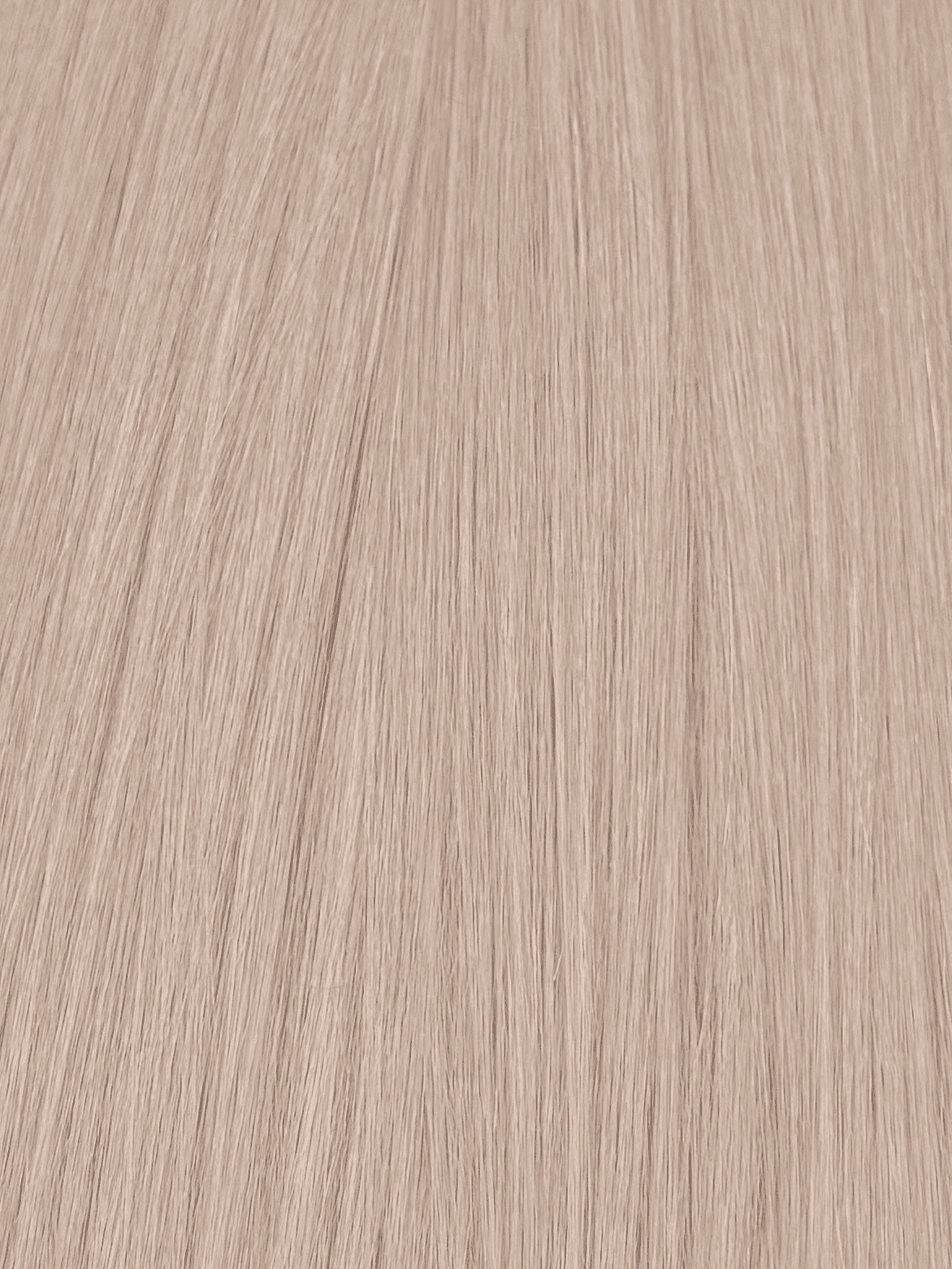 Close-up of textured light brown wood surface.