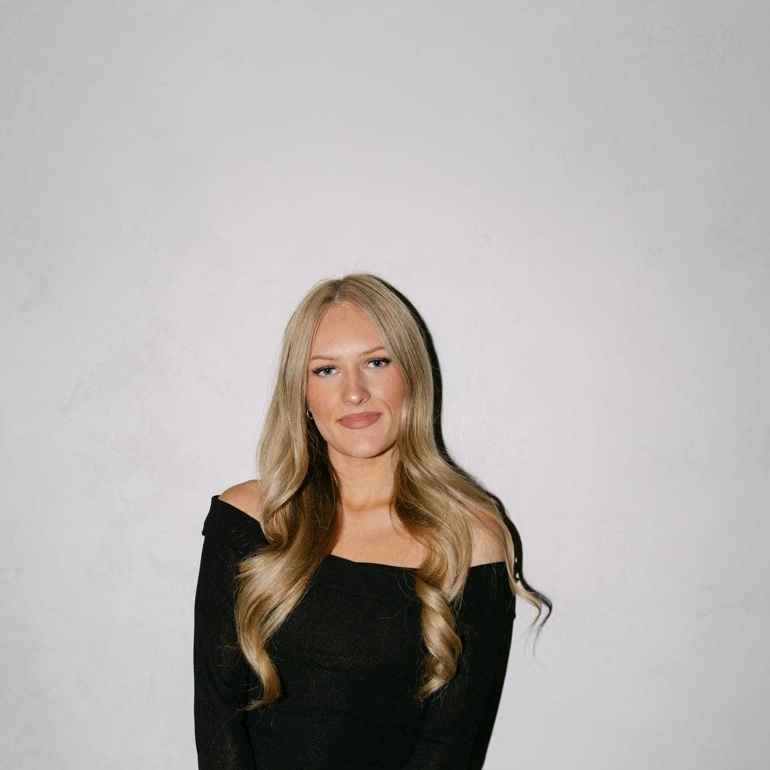 Portrait of Sophia Torchilo, a professional stylist at Chromatique Salon, showcasing their expertise and style.