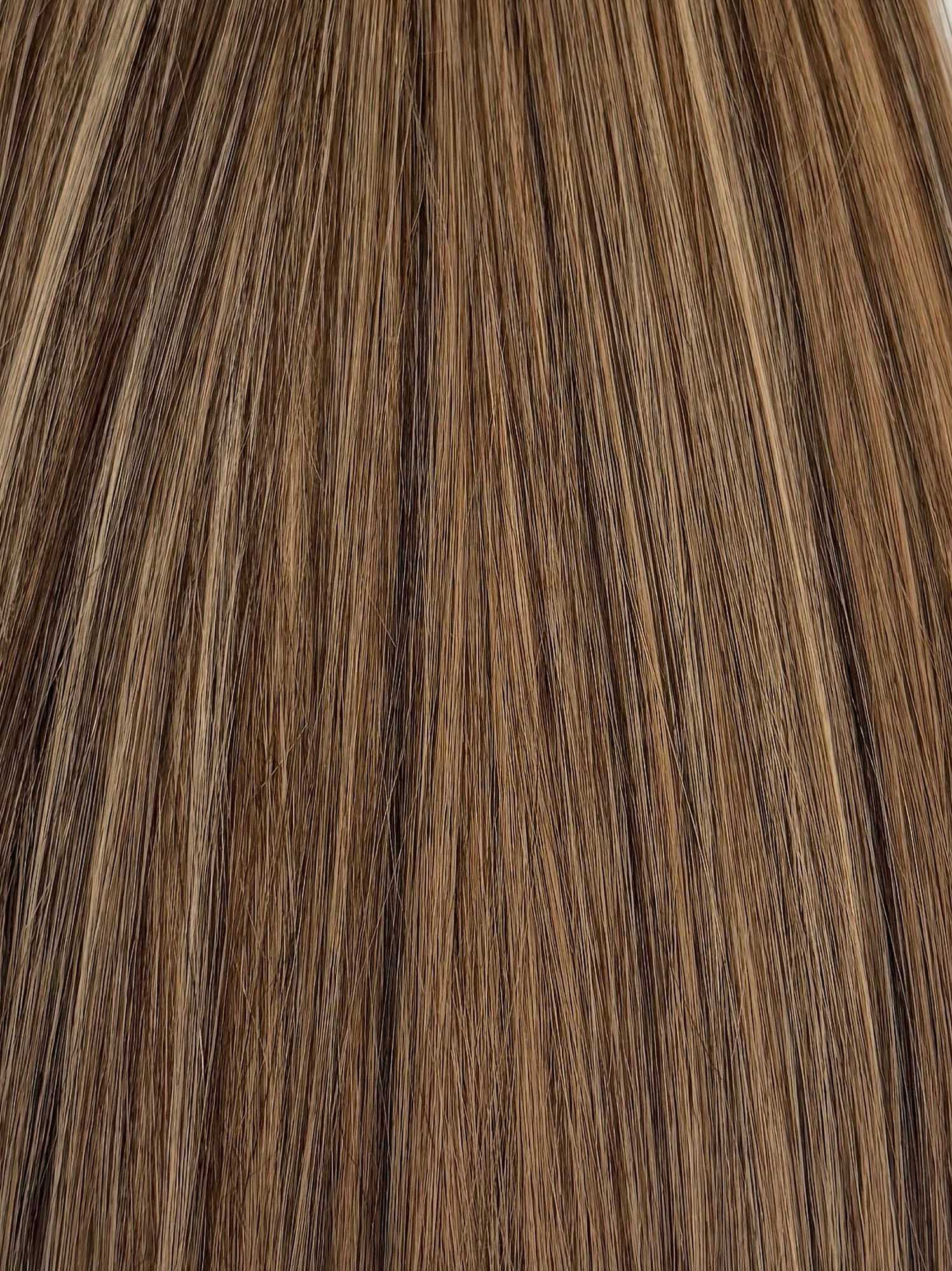 Brown and blonde highlighted hair texture with smooth, straight strands.