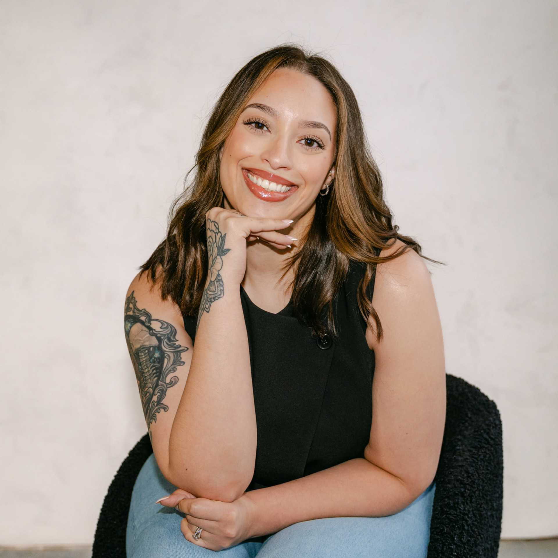 Portrait of Cierra Jarrell, a professional stylist at Chromatique Salon, showcasing their expertise and style.