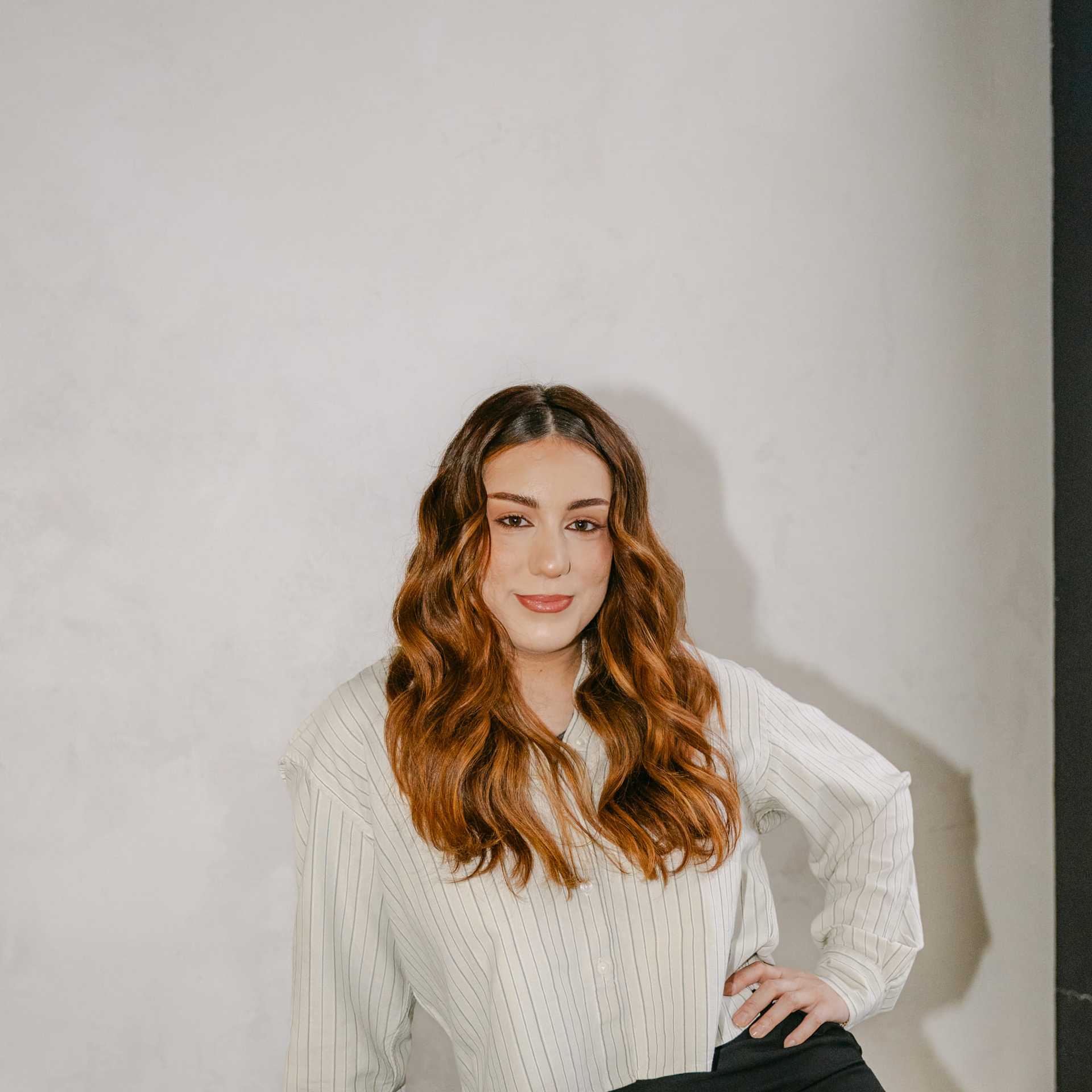 Portrait of Melissa Hawkins, a professional stylist at Chromatique Salon, showcasing their expertise and style.