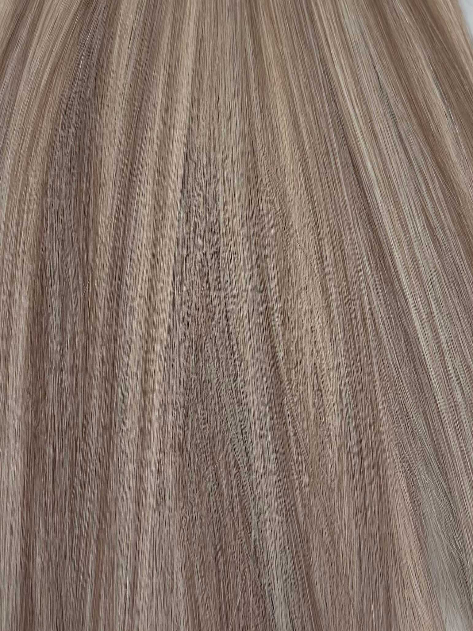 Light brown hair with subtle highlights and a smooth, shiny texture.