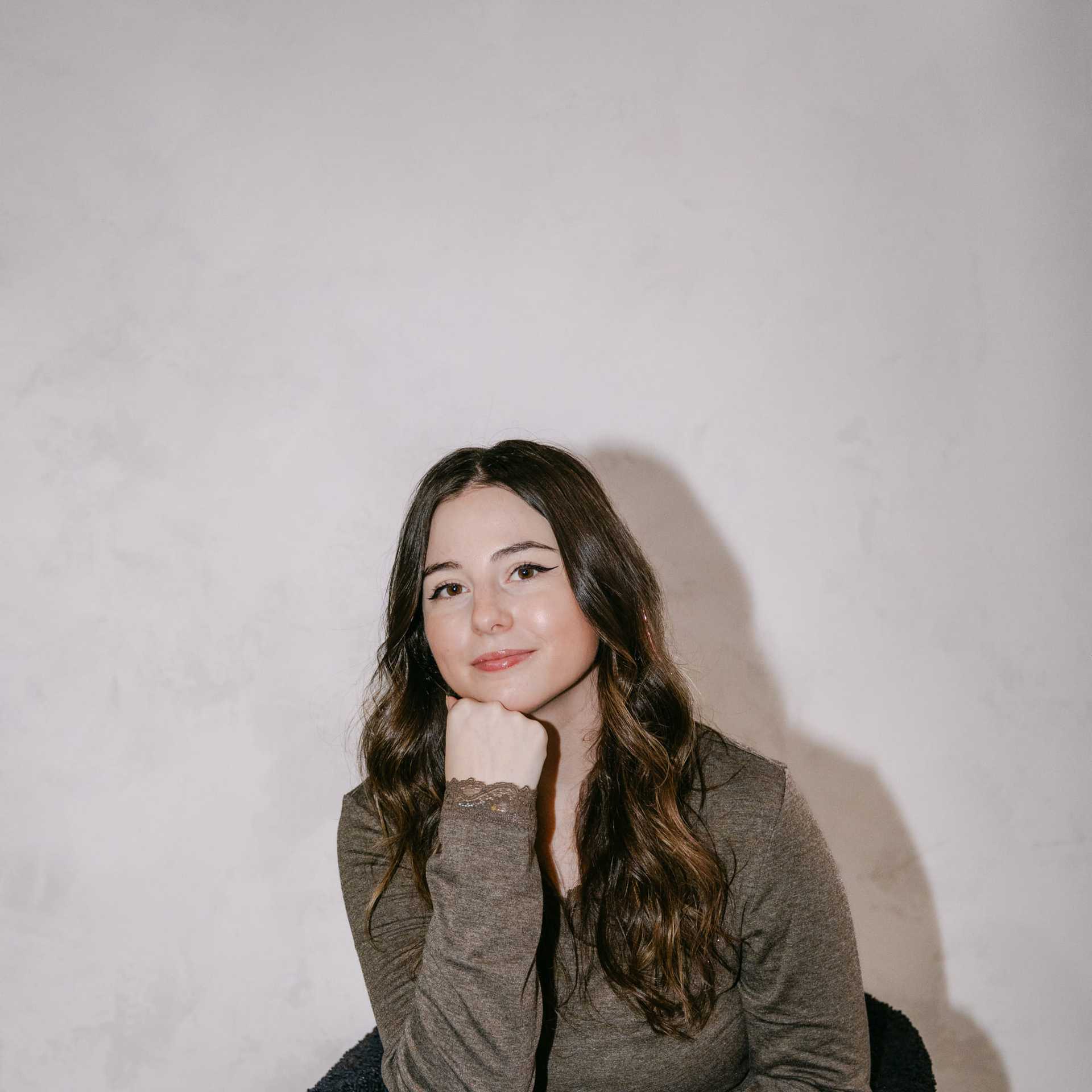 Portrait of Trinity West, a professional stylist at Chromatique Salon, showcasing their expertise and style.