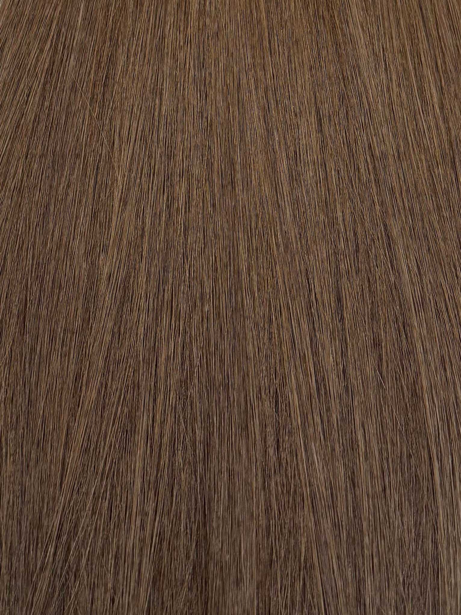 Close-up texture of light brown hair strands.